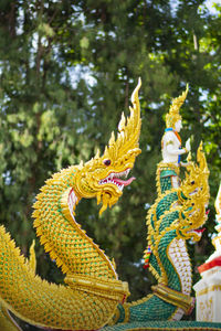 Statue of a serpent at the stairs inside the thai temple, thailand, thai pattern, serpent, naga