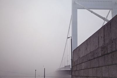 Bridge against sky during foggy weather