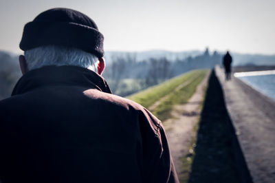 Rear view of man standing outdoors