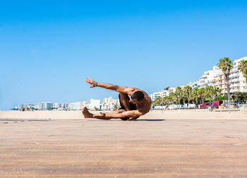 Sportsman practicing stretching and calisthenics