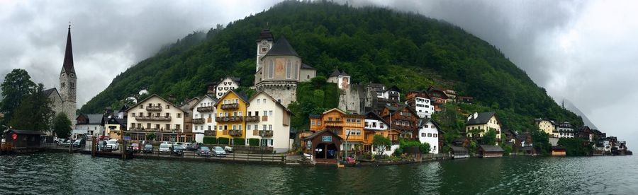 Panoramic view of old town against cloudy sky