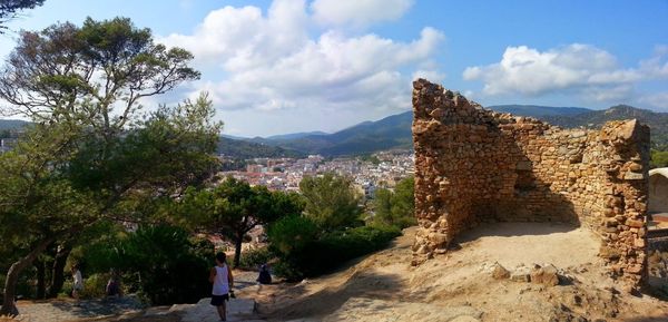 Panoramic view of trees and mountains against sky