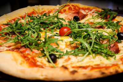 Close-up of pizza served in plate