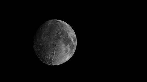 Moon in dark sky