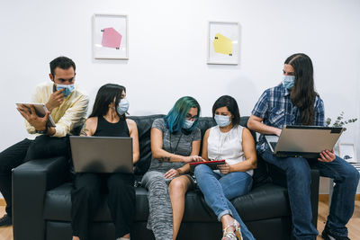 Group of young people during a break in a coworking office.