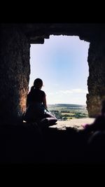 Woman standing against sky