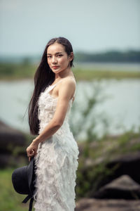 Beautiful bride standing outdoors