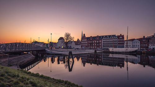 View of bridge over river during sunset