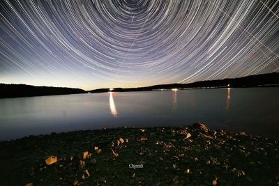 Scenic view of calm lake at night