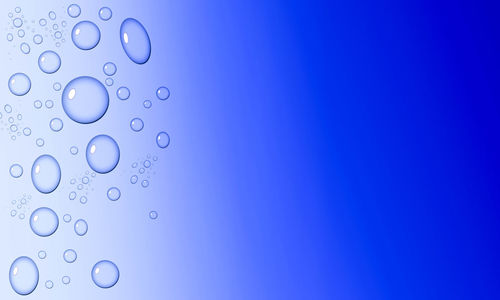 Close-up of bubbles against blue background