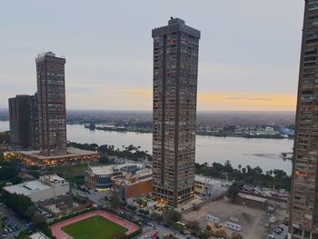 High angle view of buildings in city during sunset