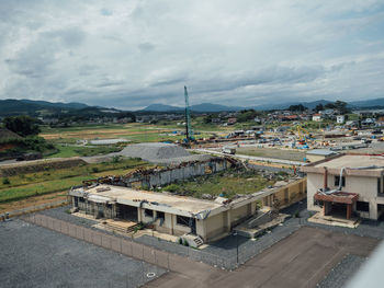 High angle view of buildings in city against sky