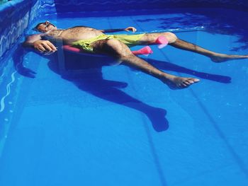 View of woman in blue sea