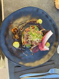 High angle view of chopped vegetables in plate on table