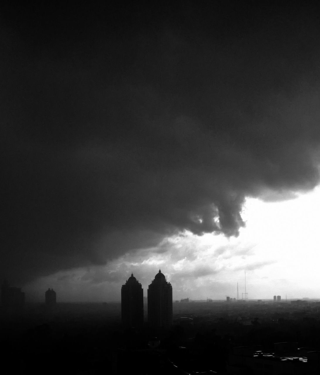 building exterior, architecture, built structure, sky, cloud - sky, city, silhouette, cloudy, cityscape, weather, tower, dusk, building, overcast, skyscraper, cloud, outdoors, low angle view, no people, tall - high