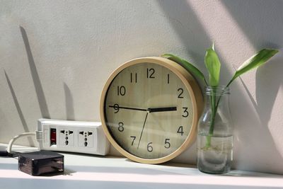 Close-up of clock on wall