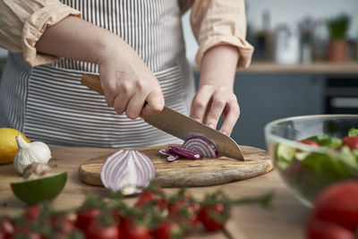 Midsection of man preparing food on table