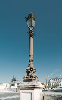 Low angle view of statue against clear blue sky