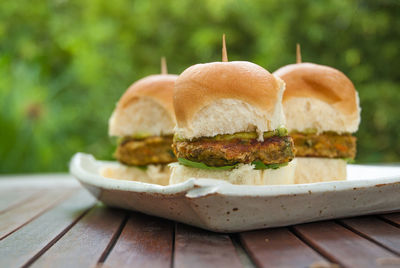 Close-up of burgers in plate on table