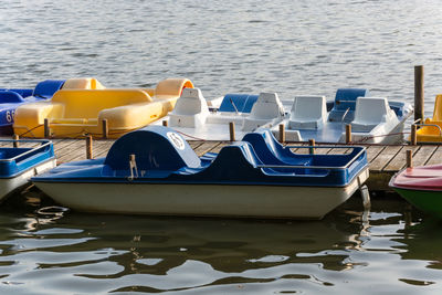 Boats moored in lake