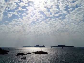 Silhouette of boats in calm sea