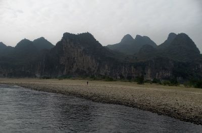 Scenic view of landscape and mountains against sky