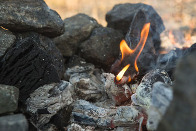 Close-up of bonfire on rocks