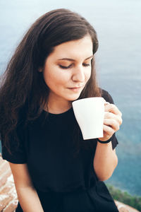 Close-up of a woman drinking coffee