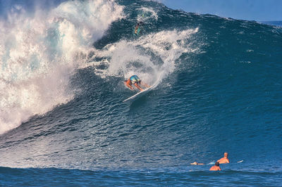 People swimming in sea