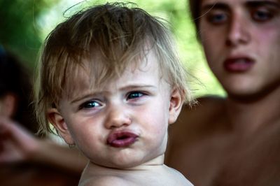 Close-up portrait of cute baby outdoors