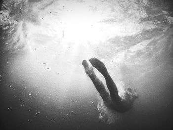 Woman swimming underwater