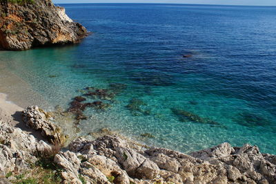 High angle view of sea against blue sky