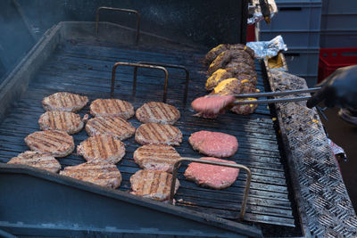 Man preparing food on barbecue grill