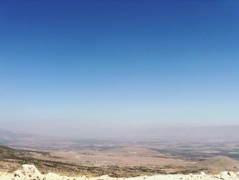 Scenic view of landscape against clear blue sky