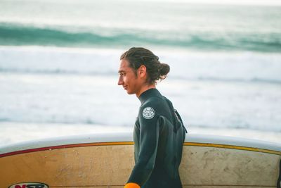 Young man looking at sea