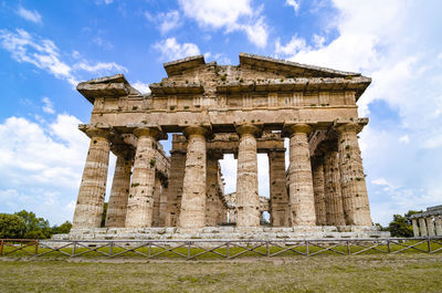 Front view of historical building against clear blue sky  , temple of paestum. italy