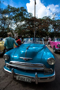 Cars on road against sky