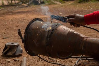 Close-up of hand welding metal