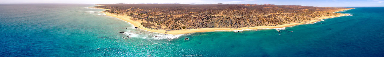 Panoramic view of blue sea on sunny day