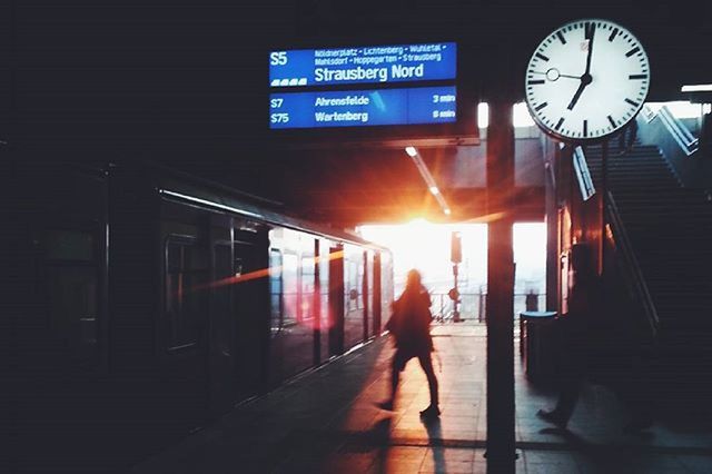 text, communication, architecture, built structure, western script, building exterior, men, sign, lifestyles, illuminated, information sign, guidance, city life, transportation, city, non-western script, clock, leisure activity