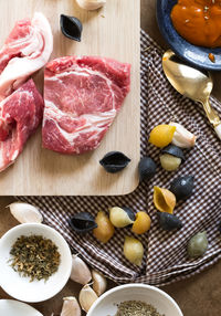 Directly above shot of meat and conchiglie pasta with ingredients on kitchen counter