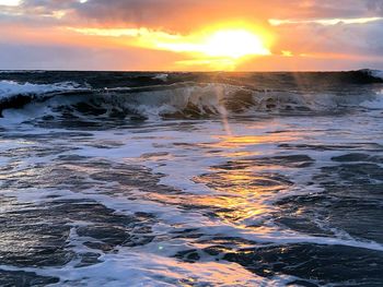 Scenic view of sea against sky during sunset