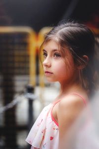 Portrait of beautiful young woman looking away