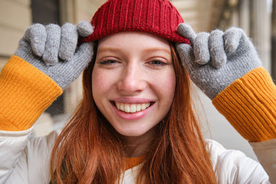 Portrait of young woman wearing knit hat