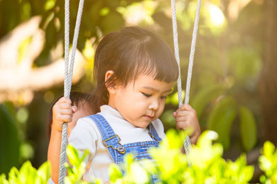 Close-up of girl holding hands