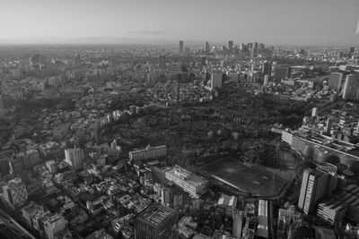 High angle view of city buildings against sky