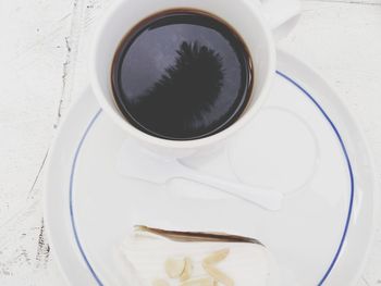 High angle view of coffee cup on table