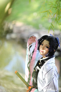 Portrait of young woman standing outdoors