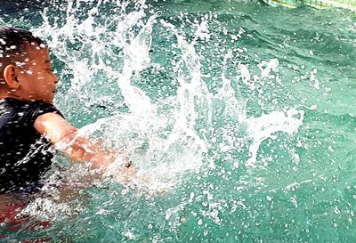 Man swimming in pool