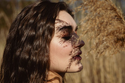 Portrait of young woman looking away